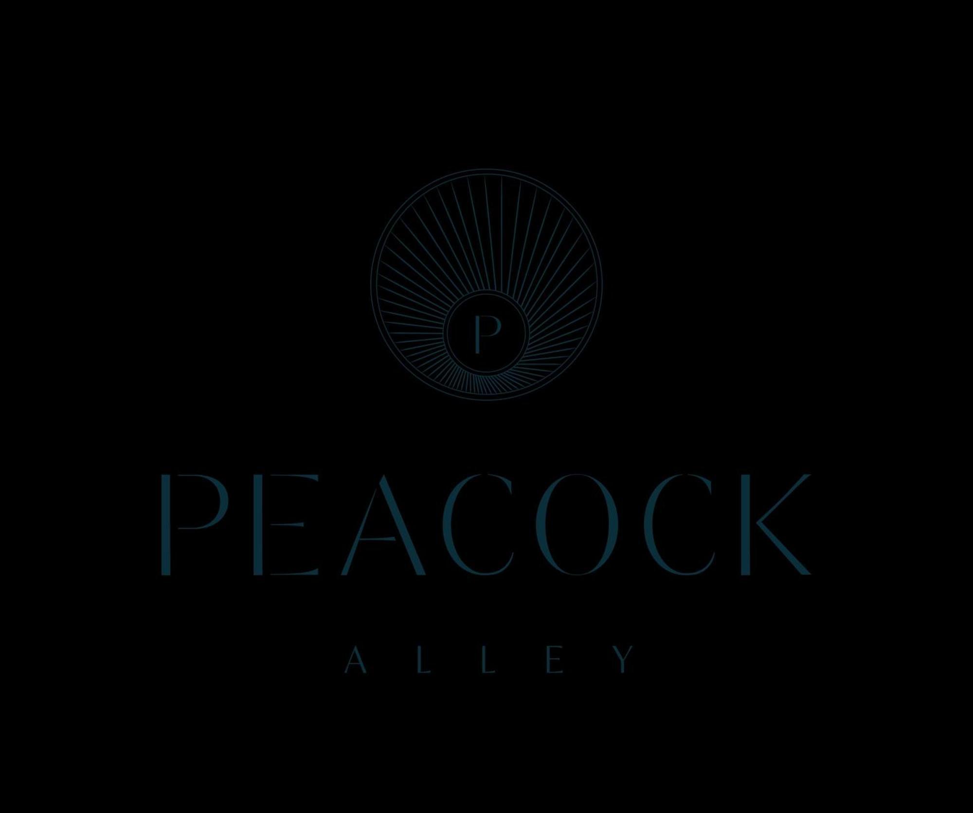 Waldorf Astoria Dubai Palm Jumeirah Esterno foto Peacock Alley logo